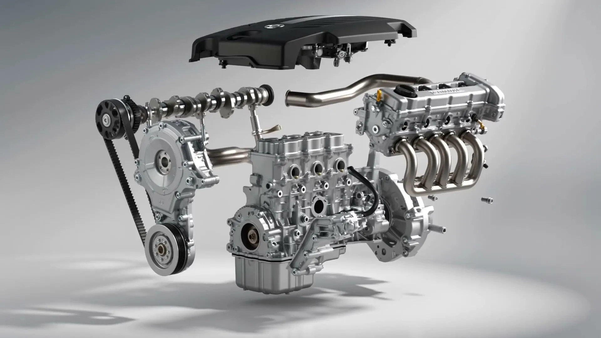 A brand-new replacement car engine, components laid out in clean studio light